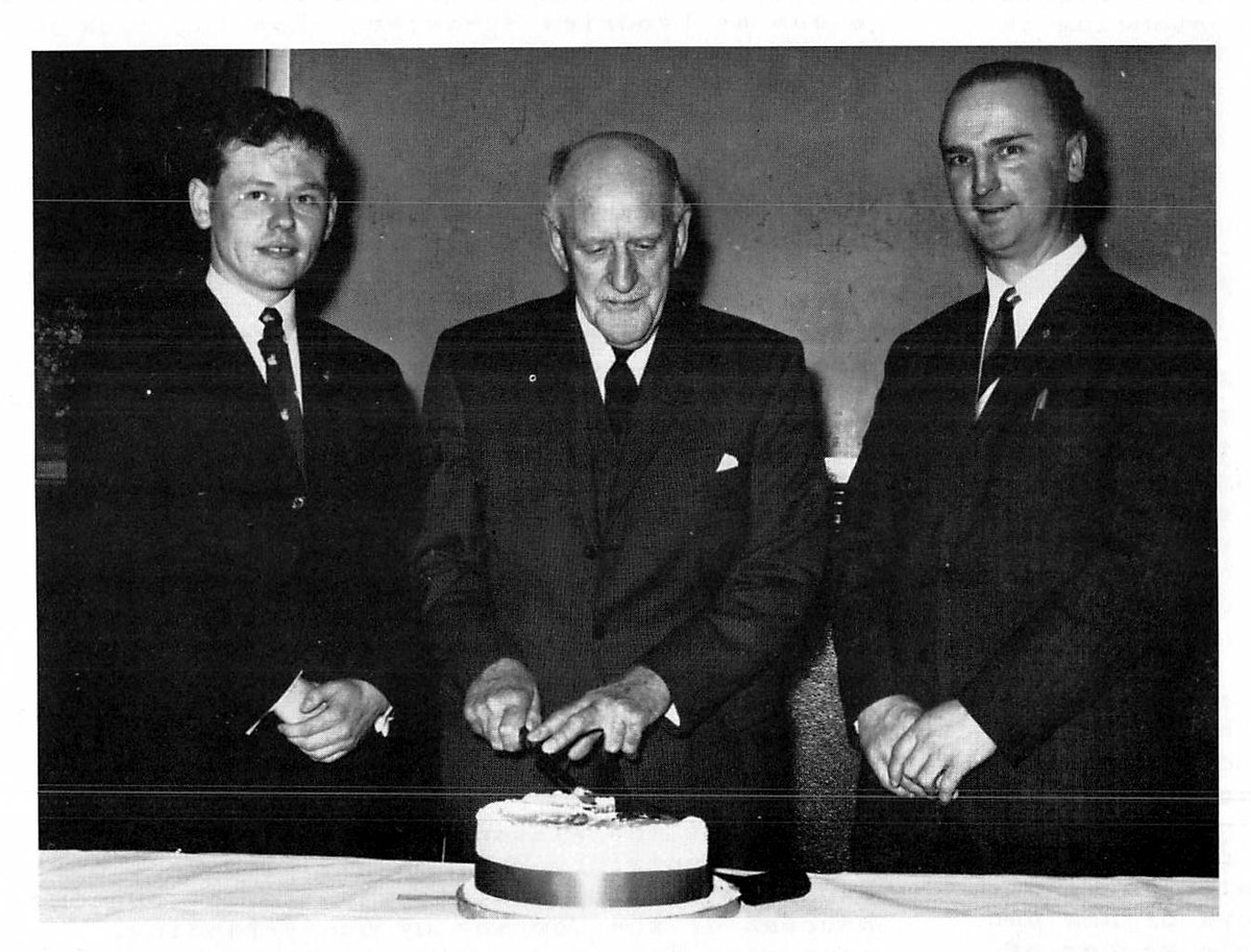 The three Company Captains cutting the cake: Trevor Wilson, Lendrick McMaster and Harry Downie
